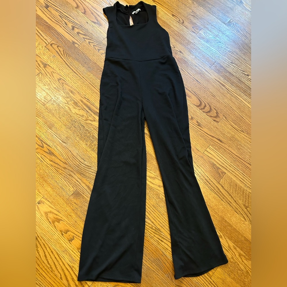 Anistar size medium bosck jumpsuit . Buttons on the back collar.